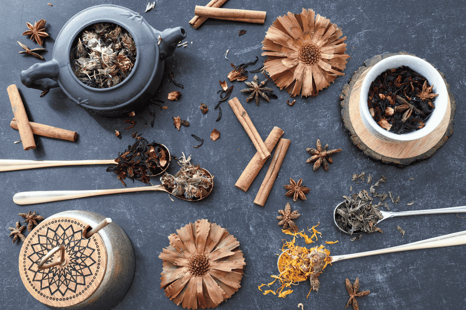 Flat lay of whole spices and aromatic herbs for masala chai, including star anise, green cardamom pods, fennel seeds, and cinnamon sticks, alongside tea leaves and chai masala powder for authentic masala chai. This spiced tea tradition from the Indian subcontinent blends black tea, darjeeling tea, assam tea, or green tea with fresh ginger, ground ginger, aromatic spices, and spice mix from tea plantations in South India. Perfect for tea drinkers and indian tea drinking culture, masala chai translates to traditional Indian tea brewed with milk and sugar, oat milk, or steamed milk, sweetened with brown sugar, coconut sugar, or maple syrup. Whether enjoyed as a chai tea latte, chai latte, milky tea, or milky cup, it’s a hot cup of comfort. Prepared with loose tea, black tea bags, or ctc tea, this tea brewed with tea masala and masala tea can be aerate chai for froth. Rooted in indian masala chai heritage, it reflects indian tea culture, tea trade, tea board standards, tea production, and tea sellers or tea vendors sourcing all the spices from south asian grocery stores. Served by chai vendors at tea stalls, local coffee shop, or coffee shops, it’s the perfect cup for tea breaks, drinking tea, or review recipe moments. Infused with fragrant spices, aromatic herbs, ceylon cinnamon, and tea plant origins, this cup of chai celebrates why this recipe remains beloved among tea produced traditions worldwide.