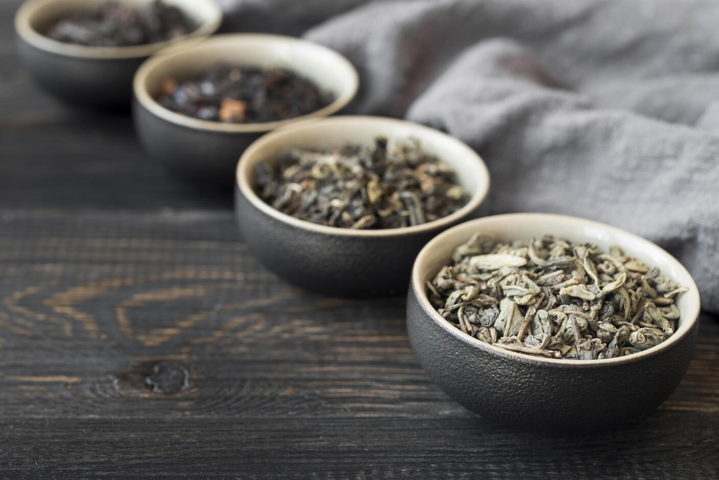 Japanese Green Tea : Different varieties of Japanese tea leaves, from gyokuro to hojicha, displayed elegantly.