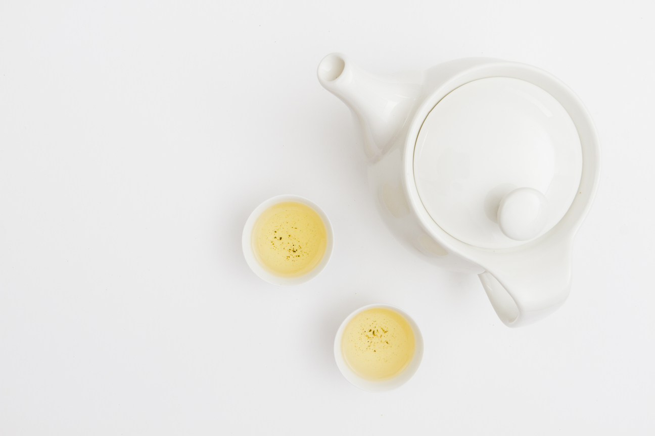 Best Park in SG: A teacup of Silver Needle white tea glowing with clarity, symbolising centuries of artistry.